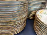 many plates stacked on top of each other on a table