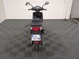 a motor scooter that is parked in a garage