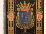 un livre noir orné de dorures et d'un blason