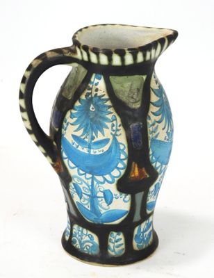 a blue and white vase sitting on a white surface