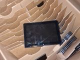 a cardboard box with a cell phone inside of it