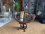 a mirror sitting on a stand in a living room