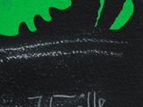 drawing of a green monster with a black background