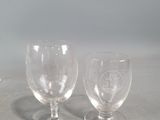 three empty wine glasses sitting on a table