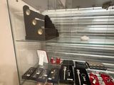 a glass display case with many different items in it
