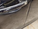 a close up of a door handle on a car