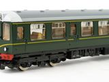 a green and yellow train car on a white surface