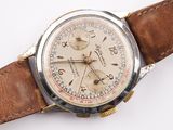 a close up of a wrist watch with a brown leather strap