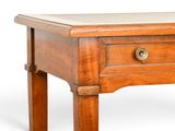 a small wooden table with a drawer on it