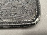 a black wallet that is sitting on top of a table