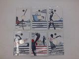 six baseball cards on a white surface with a picture of a man swinging a bat