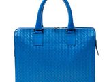 a blue bag with a handle and handles on a white background