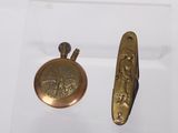 a small gold pocket watch and a small gold pocket watch