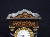 a clock that is sitting on top of a table
