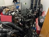 a pile of assorted electronics in a room