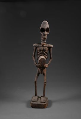 une image représentant une figurine de squelette sur fond noir