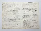 an old book with writing on it sitting on top of a table