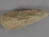 a close up of a rock on a table with a gray background