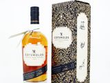 the bottle of cotswolds is next to a cardboard box