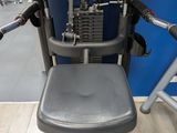 a machine that is sitting on the floor in a gym