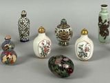 a lot of small vases that are sitting on a table