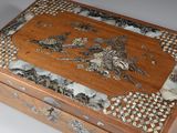 a wooden box that has a design on it