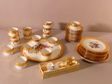 a lot of plates and cups on the table