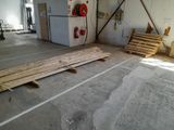 a room that has a lot of wood on the floor