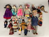 a lot of dolls that are sitting on a table