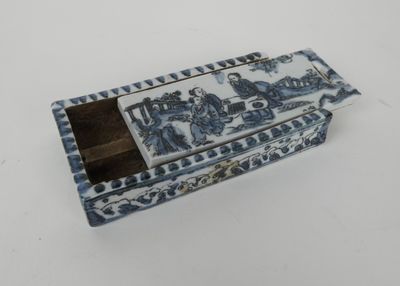 blue and white porcelain cigarette case with a design of a man and a woman