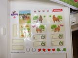 a picture of a refrigerator with stickers and magnets on it