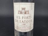 a bottle of wine that is sitting on a table