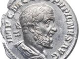 Gros plan sur une pièce de monnaie représentant un homme.