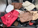 a lot of bags that are sitting in a suitcase
