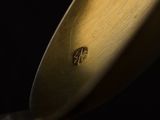 a close up of a knife on a black surface