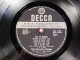vinyl record with a label of the rolling stones ' full frequency stereophonic sound