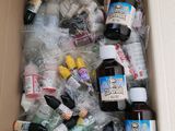 a cardboard box filled with bottles of alcohol and other items