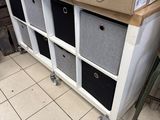 a box of flowers sitting on top of a shelf