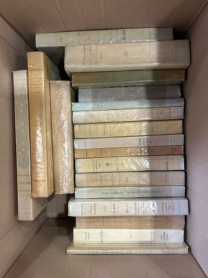 a lot of books in a box on the floor