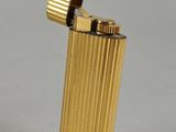 a gold lighter that is sitting on a table