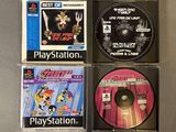 three playstation games are sitting on a table next to each other