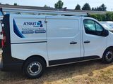 a white van that is parked in the grass