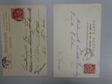 two old envelopes with stamps on them sitting on a table