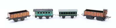 three toy trains that are lined up on a white surface
