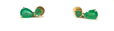 pair of emerald earrings on a white background