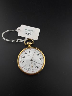 a close up of a pocket watch with a tag on it