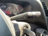 a close up of a car dashboard with a microphone in it