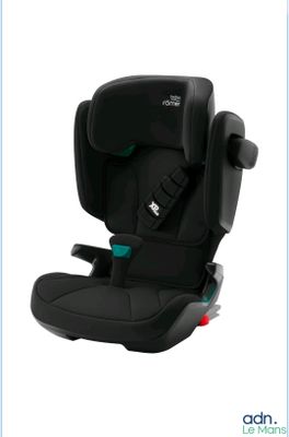 the child ' s car seat is black and has a safety belt