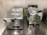 two machines that are sitting on a counter in a kitchen