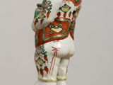 a statue of a bear on a pedestal on a table